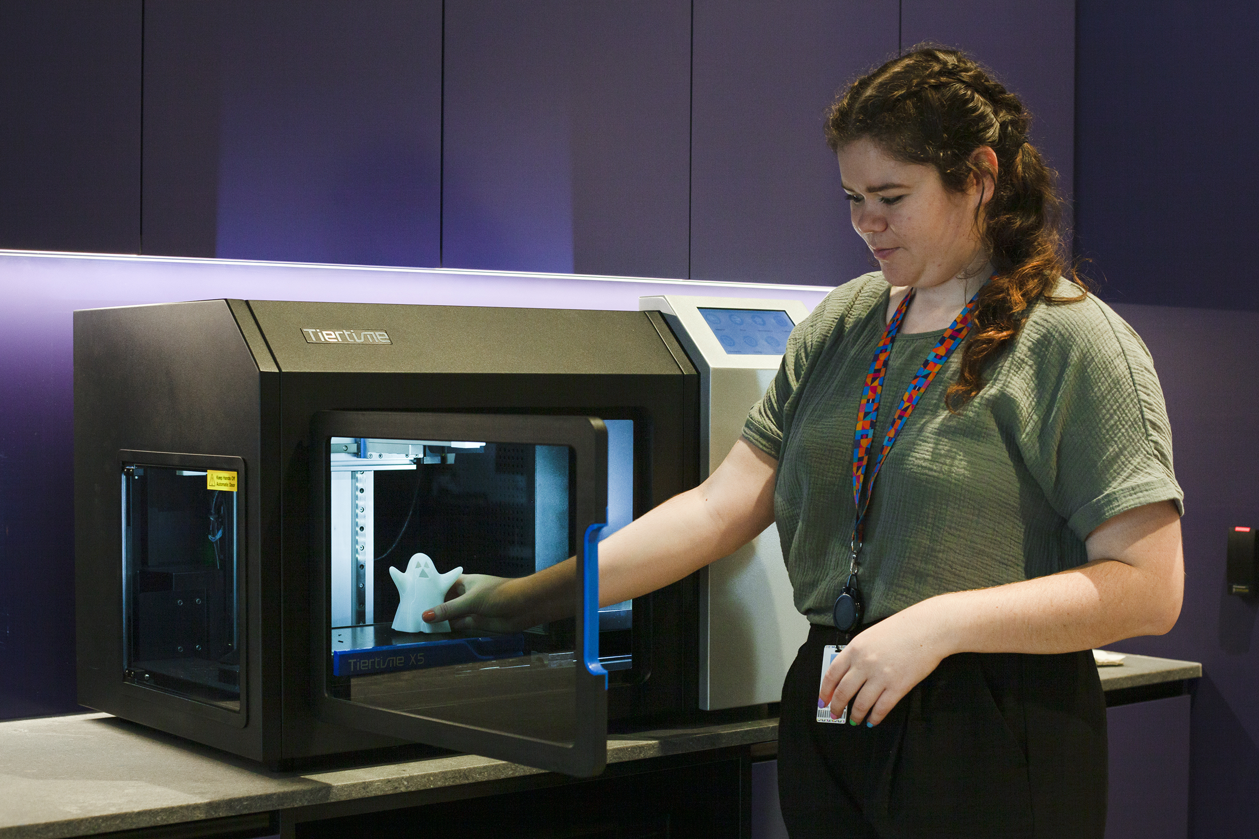 Staff member working on 3D print